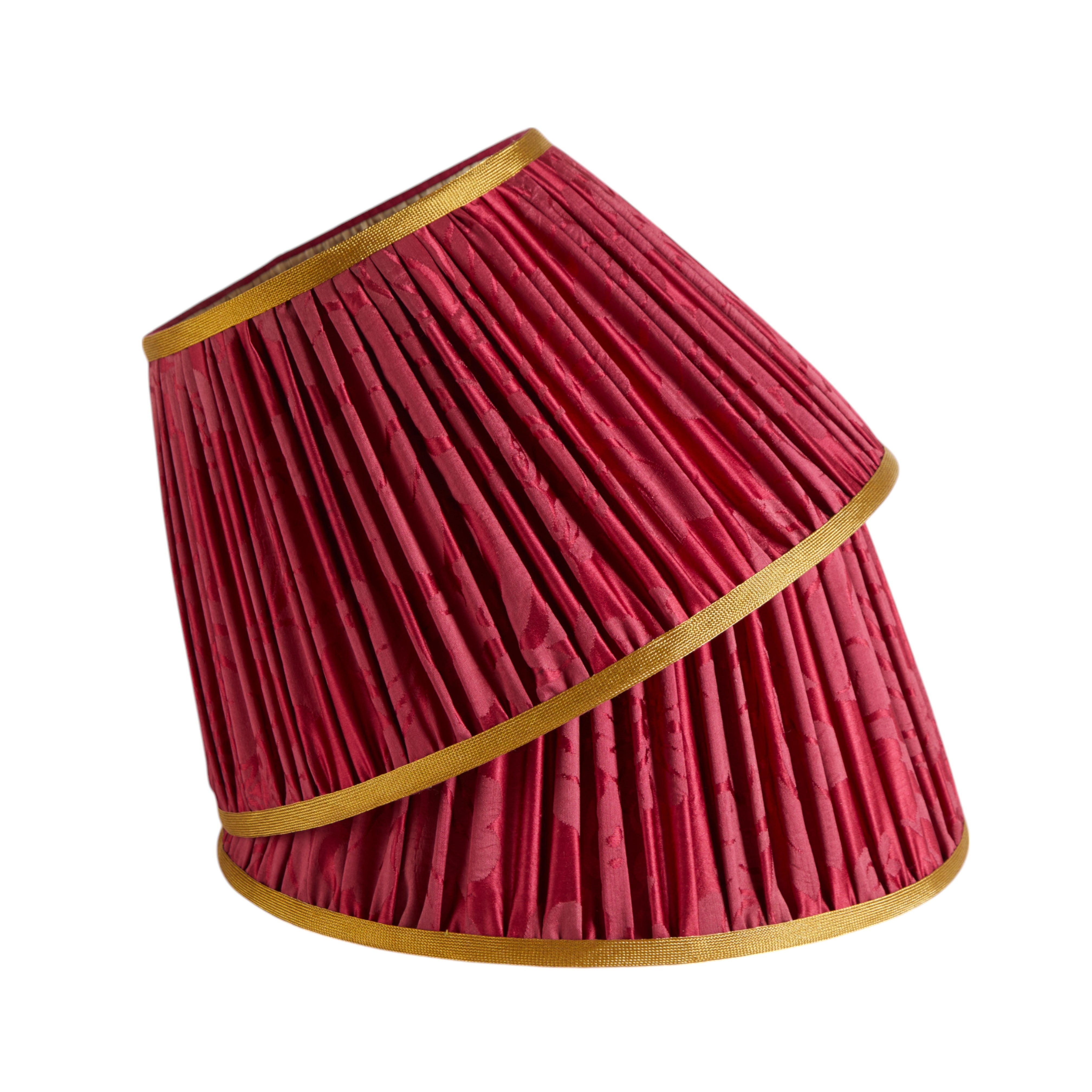 A pair of gathered lampshades in antique French damask with gold woven trimming