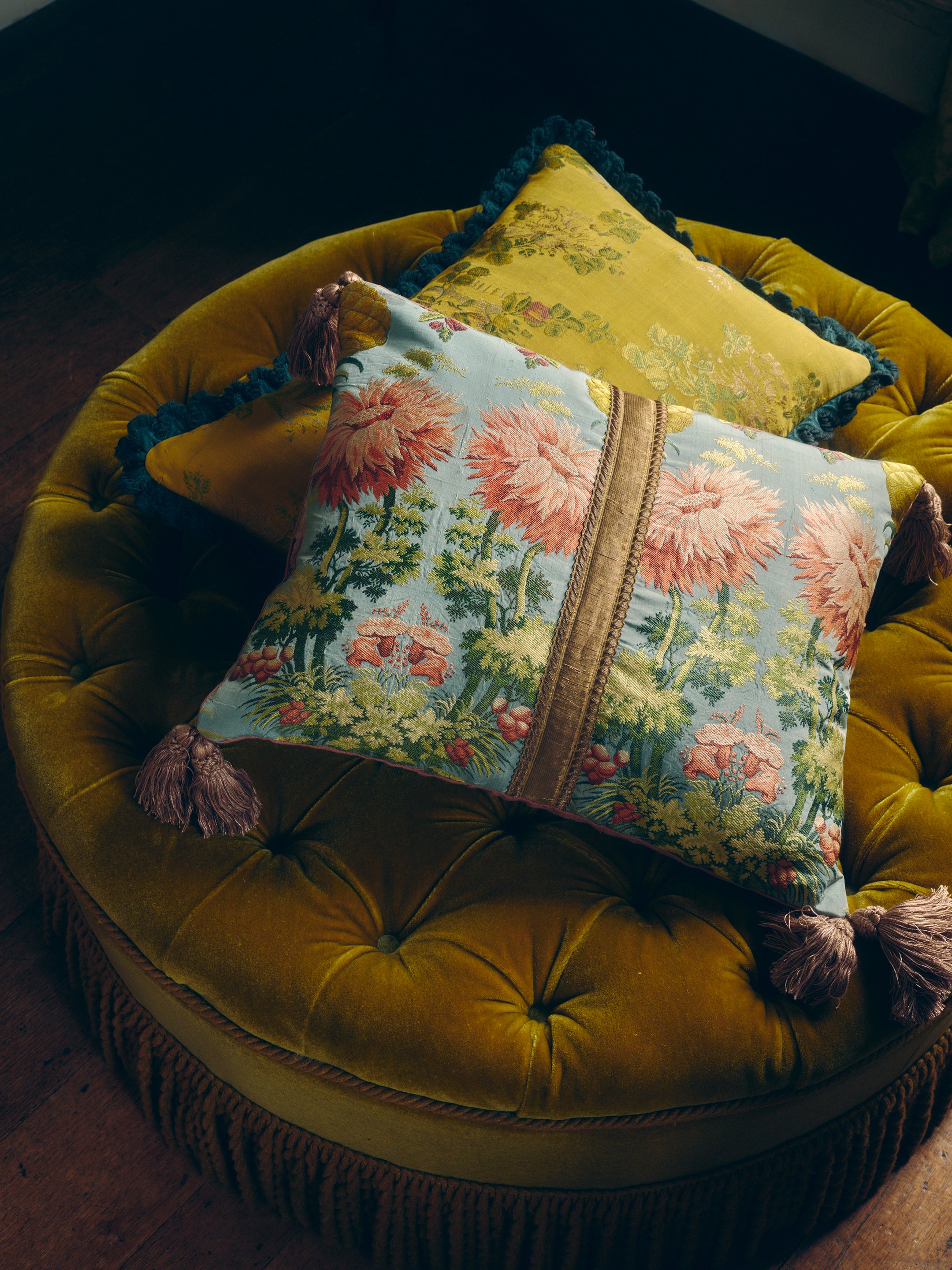 A silk cushion made with a beautiful 18th Century fragment with Italian silk tassels and antique gold flat braid band