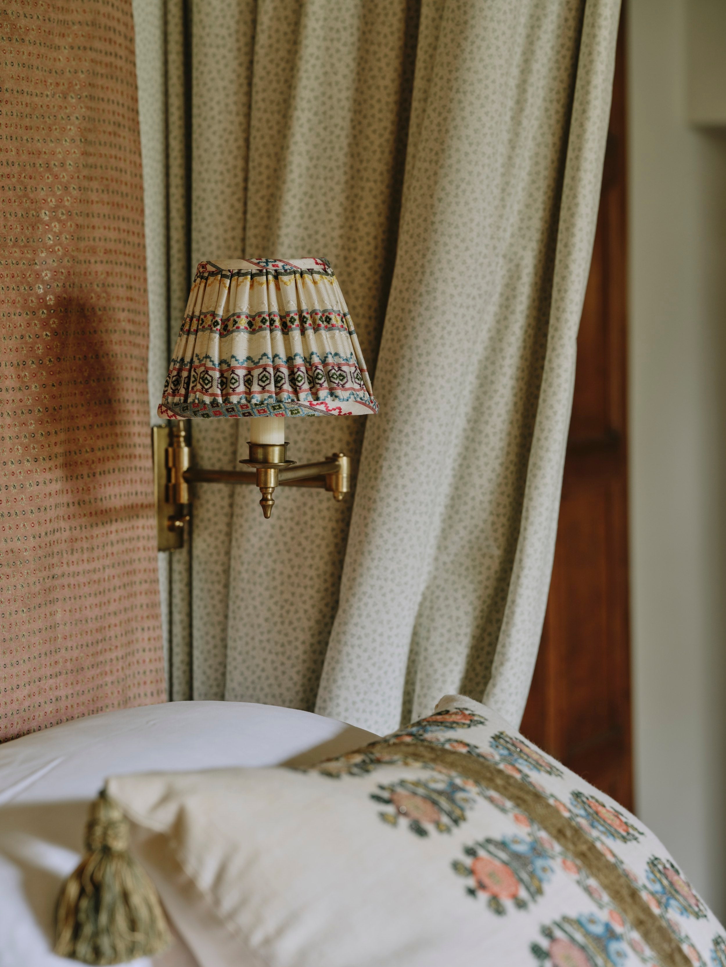 A Cushion made from an Embroidered Ottoman Fragment with Antique Braid and Corner Tassels