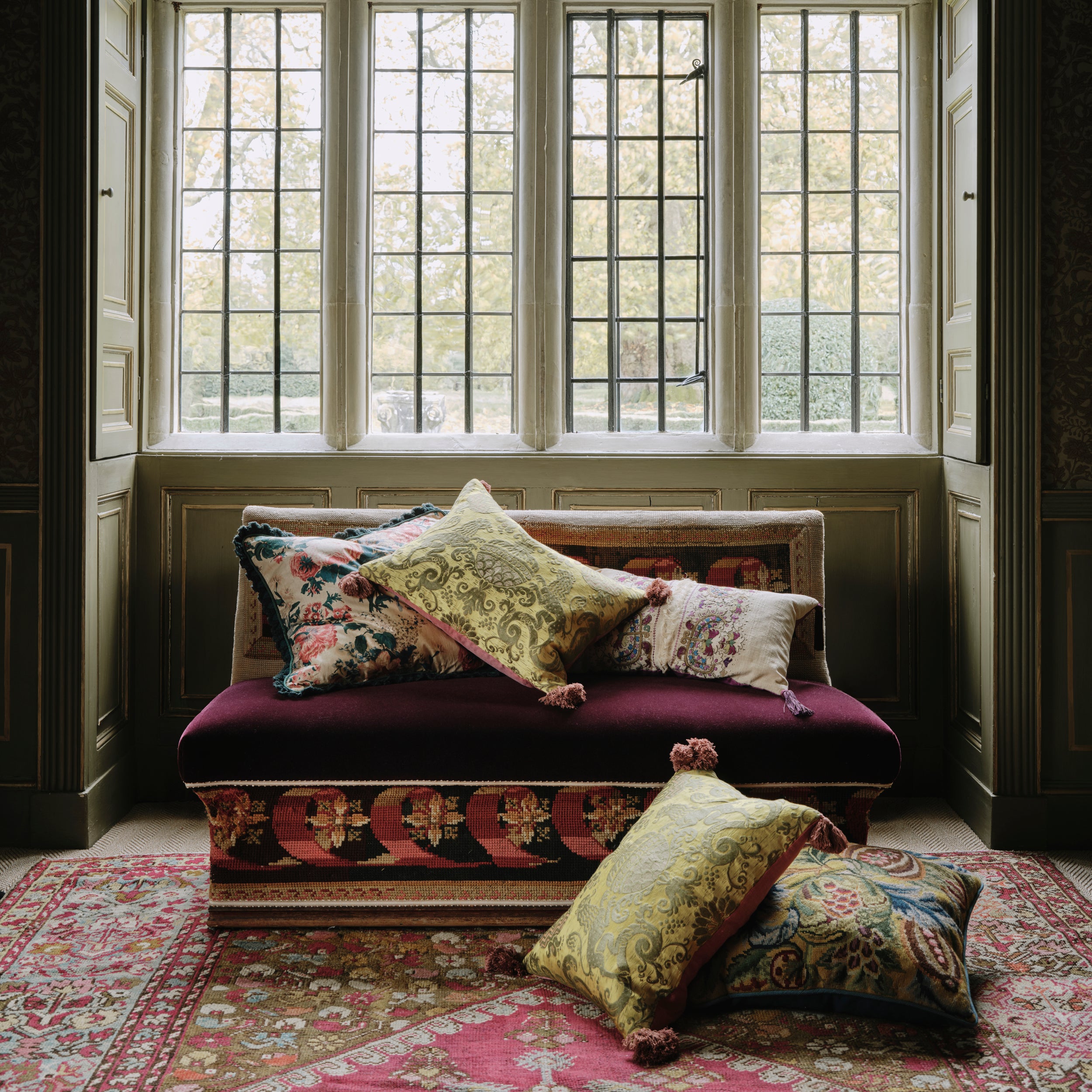 A Cushion made from Richly Coloured 20th Century English Needlework with Dark Teal Wool Piping