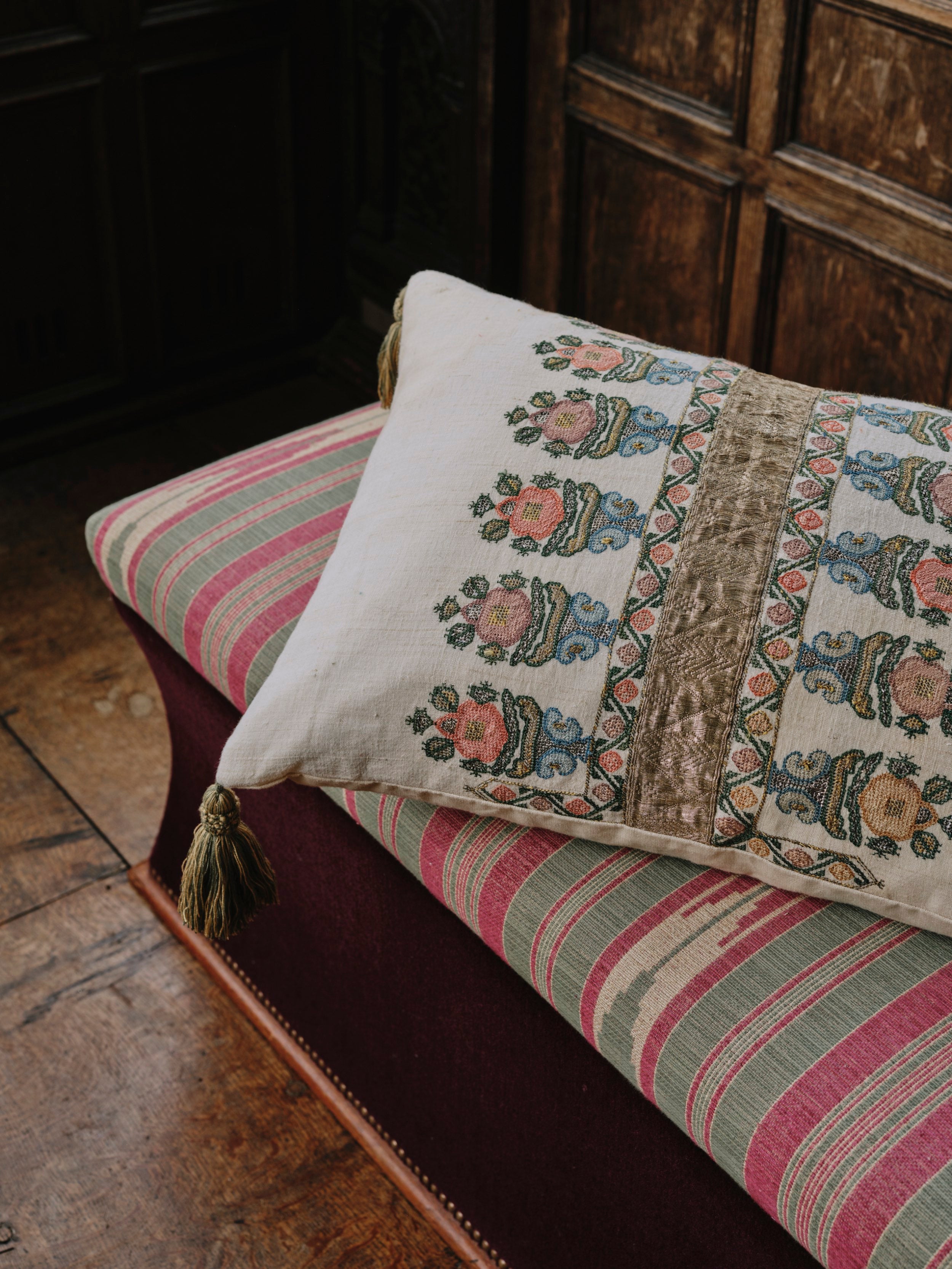 A Cushion made from an Embroidered Ottoman Fragment with Antique Braid and Corner Tassels