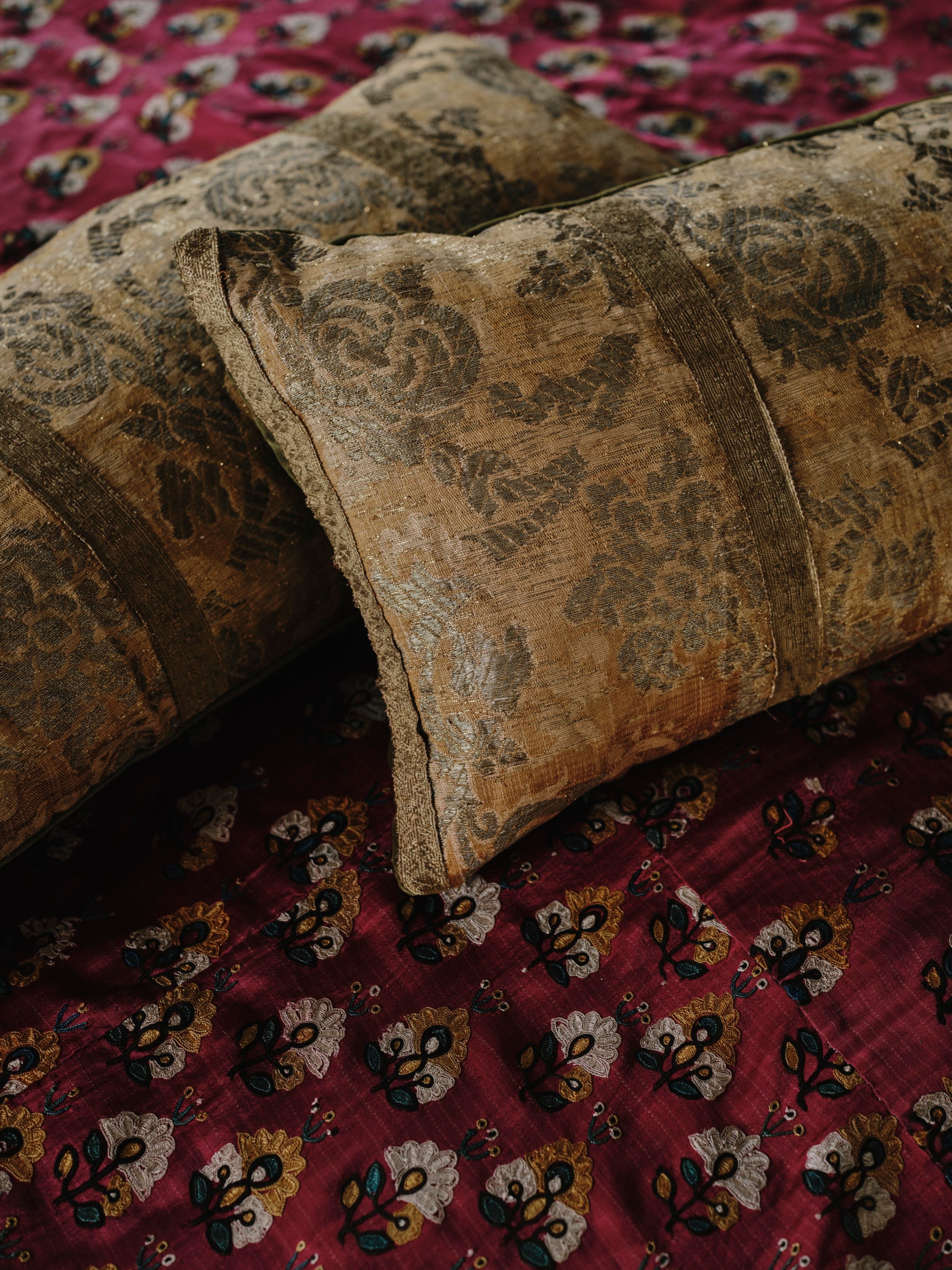 A Pair of Cushions made from Early 18th Century Gold Weave Brocade with their Original Braid