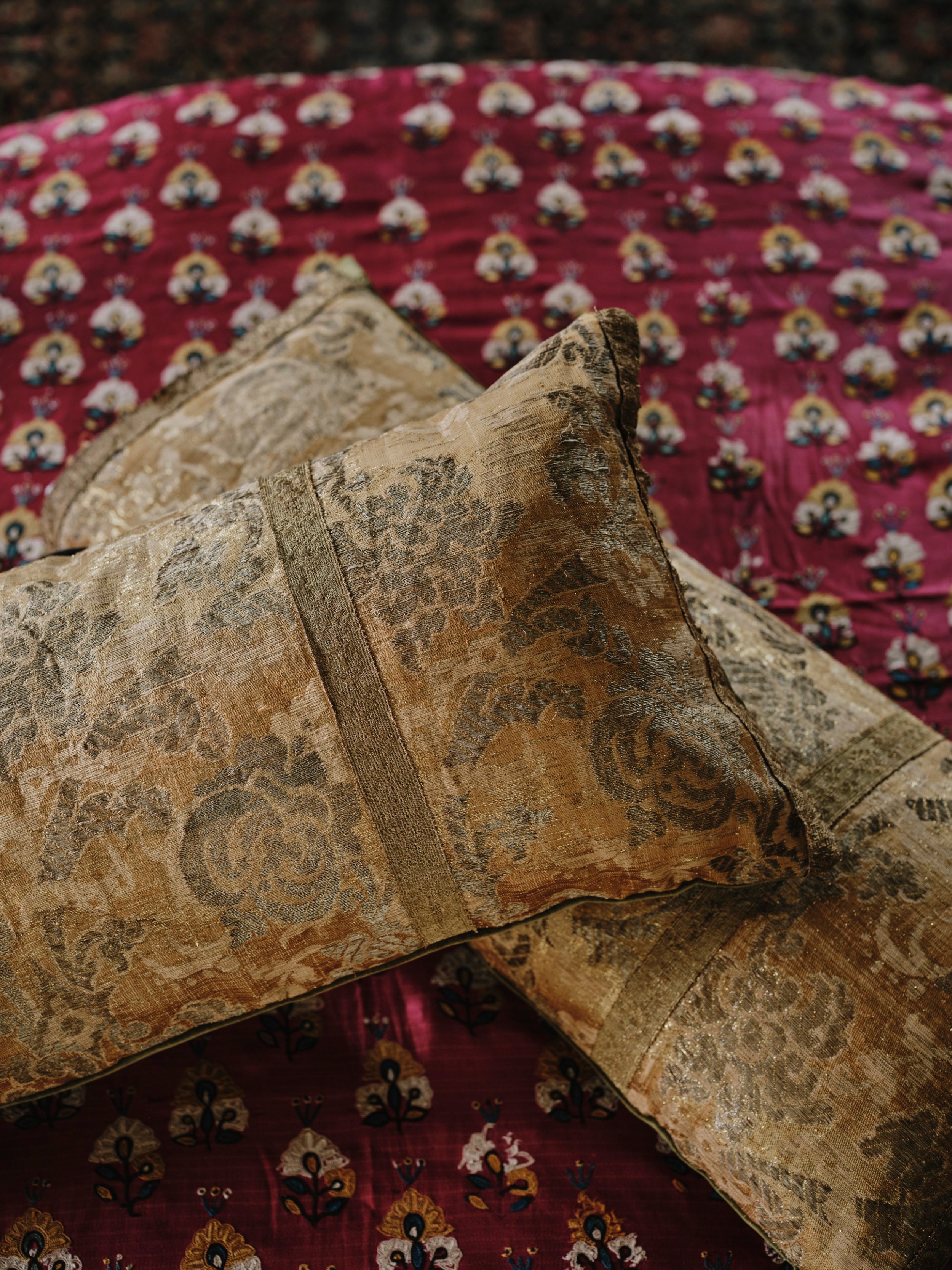 A Pair of Cushions made from Early 18th Century Gold Weave Brocade with their Original Braid