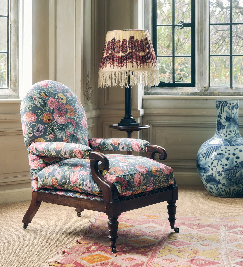 A 19th Century Round backed scroll armed chair upholstered in Flora Soames Dahlias