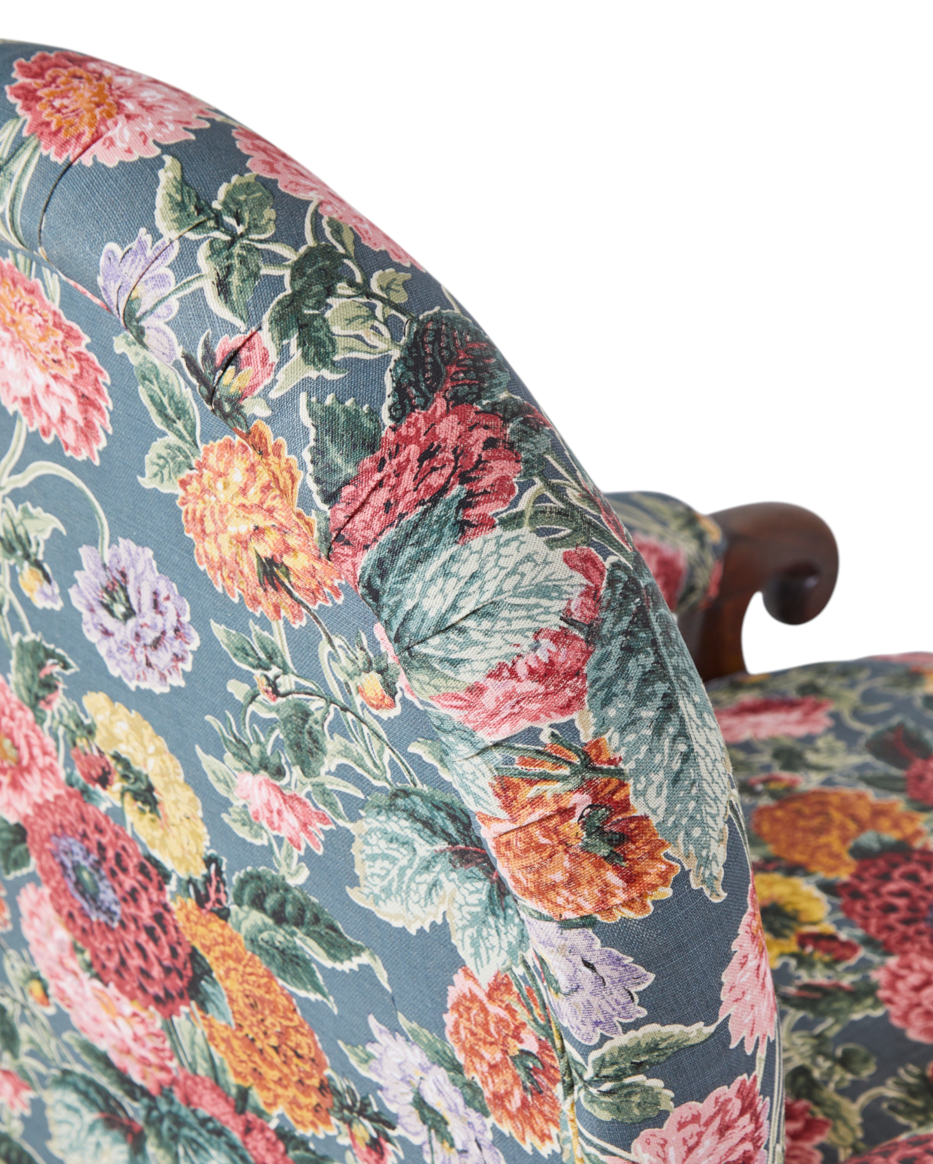 A 19th Century Round backed scroll armed chair upholstered in Flora Soames Dahlias