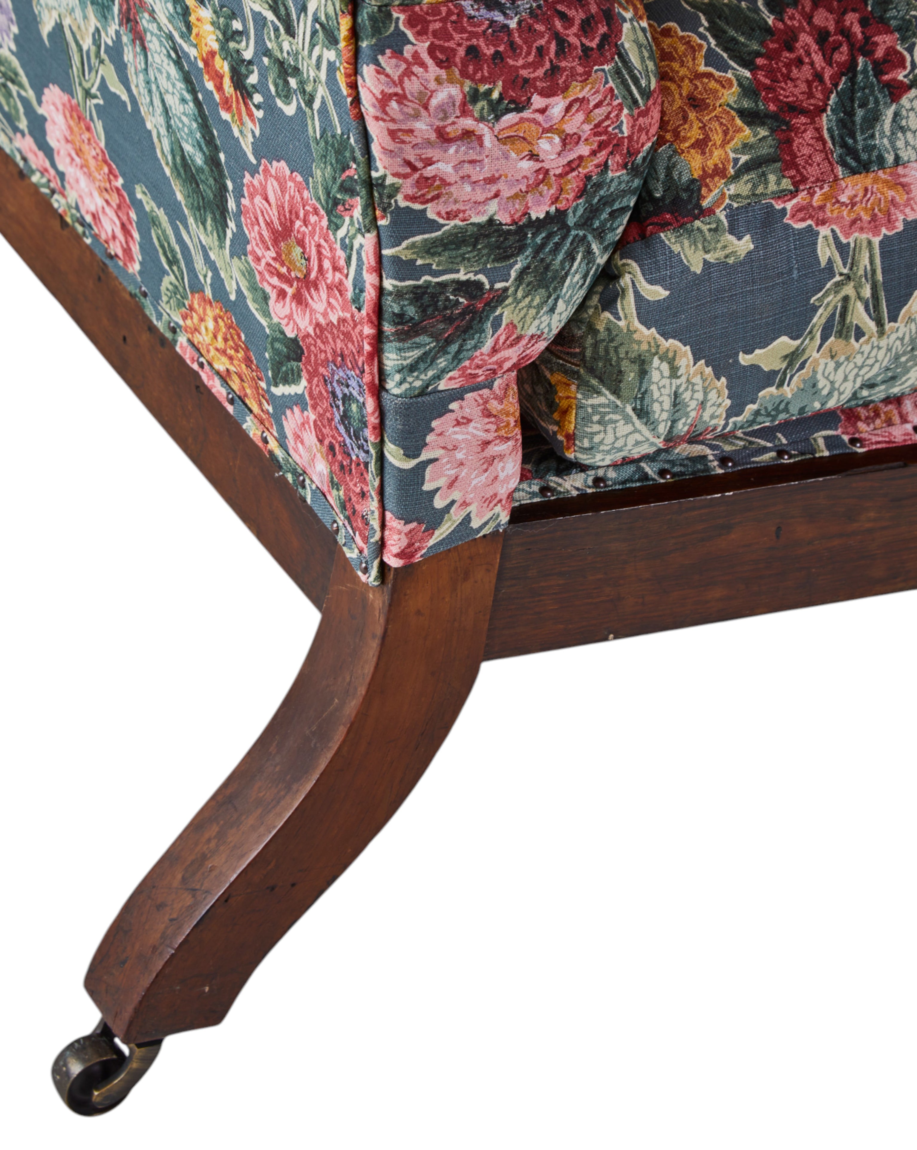 A 19th Century Round backed scroll armed chair upholstered in Flora Soames Dahlias