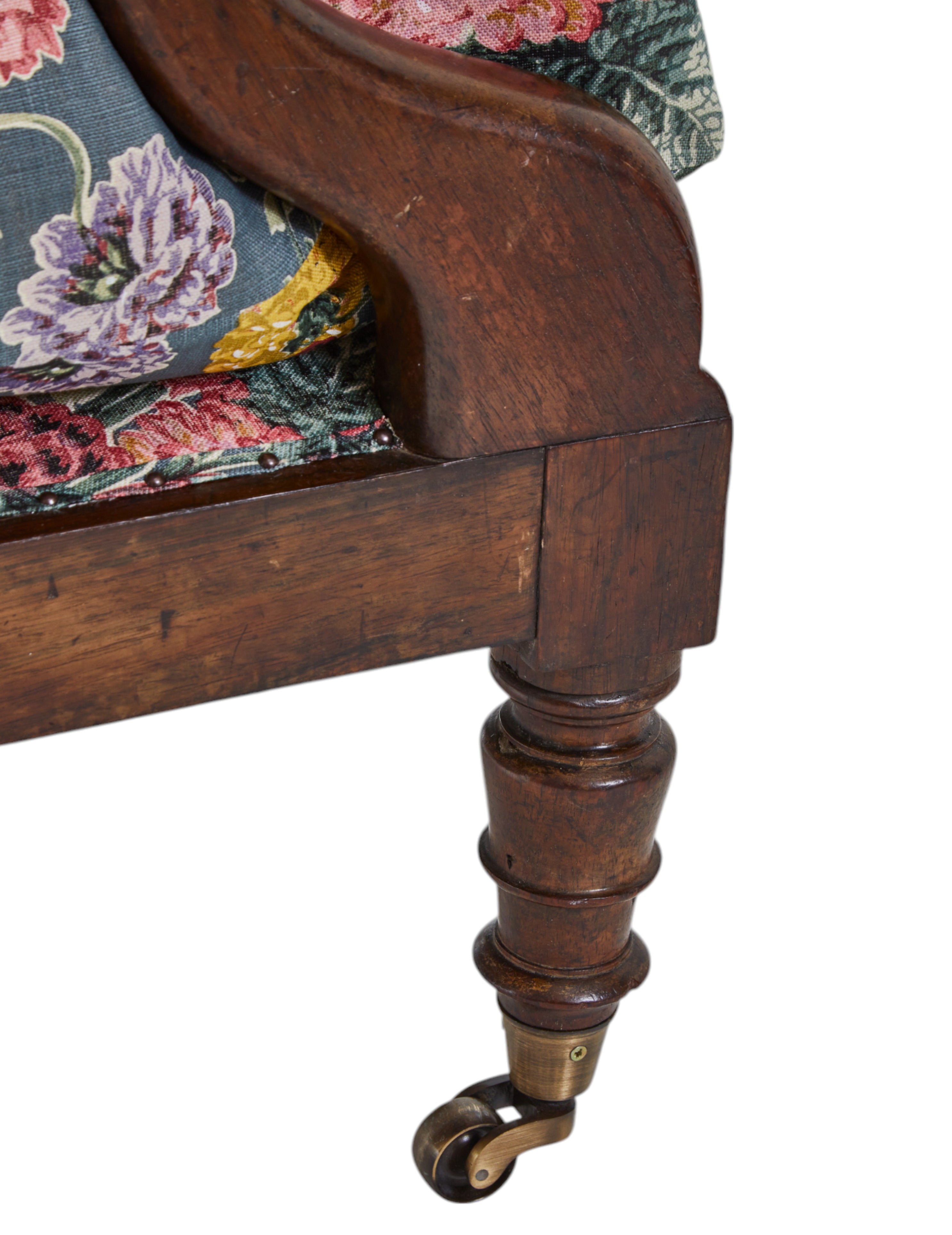 A 19th Century Round backed scroll armed chair upholstered in Flora Soames Dahlias