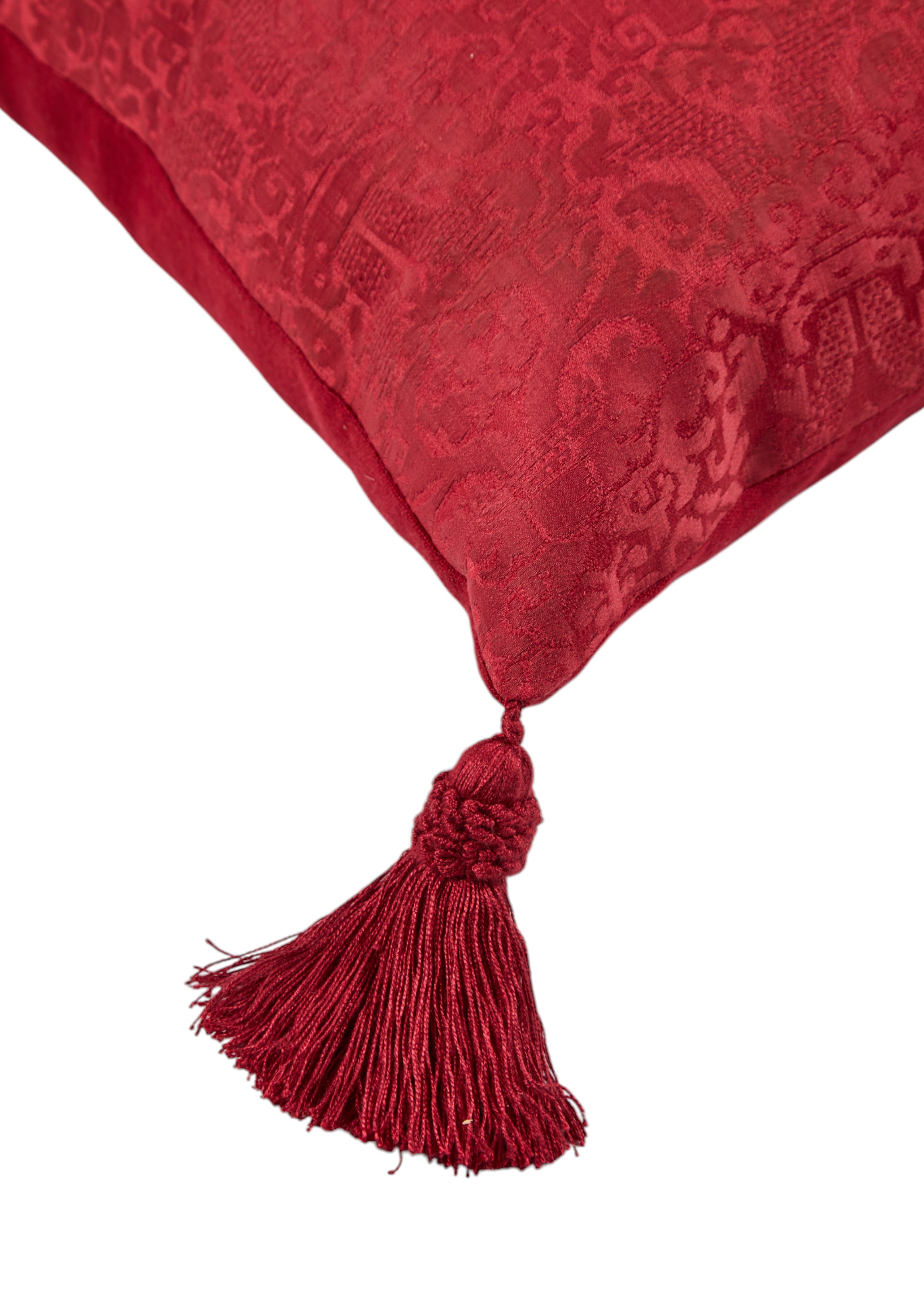 A long oblong cushion in a scarlet silk damask with 18th Century Greek Embroidered silk panel and Italian silk tassles