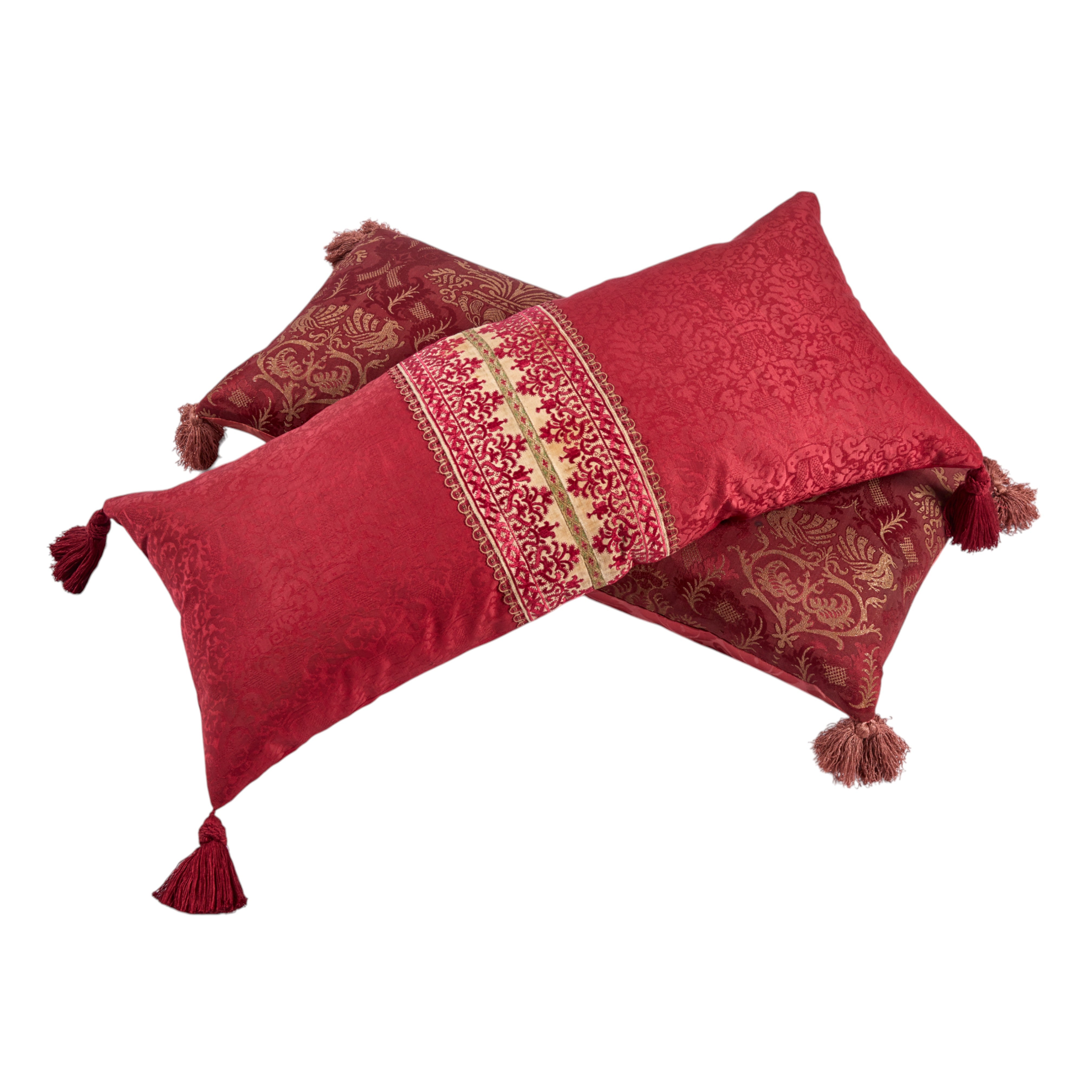 A long oblong cushion in a scarlet silk damask with 18th Century Greek Embroidered silk panel and Italian silk tassles