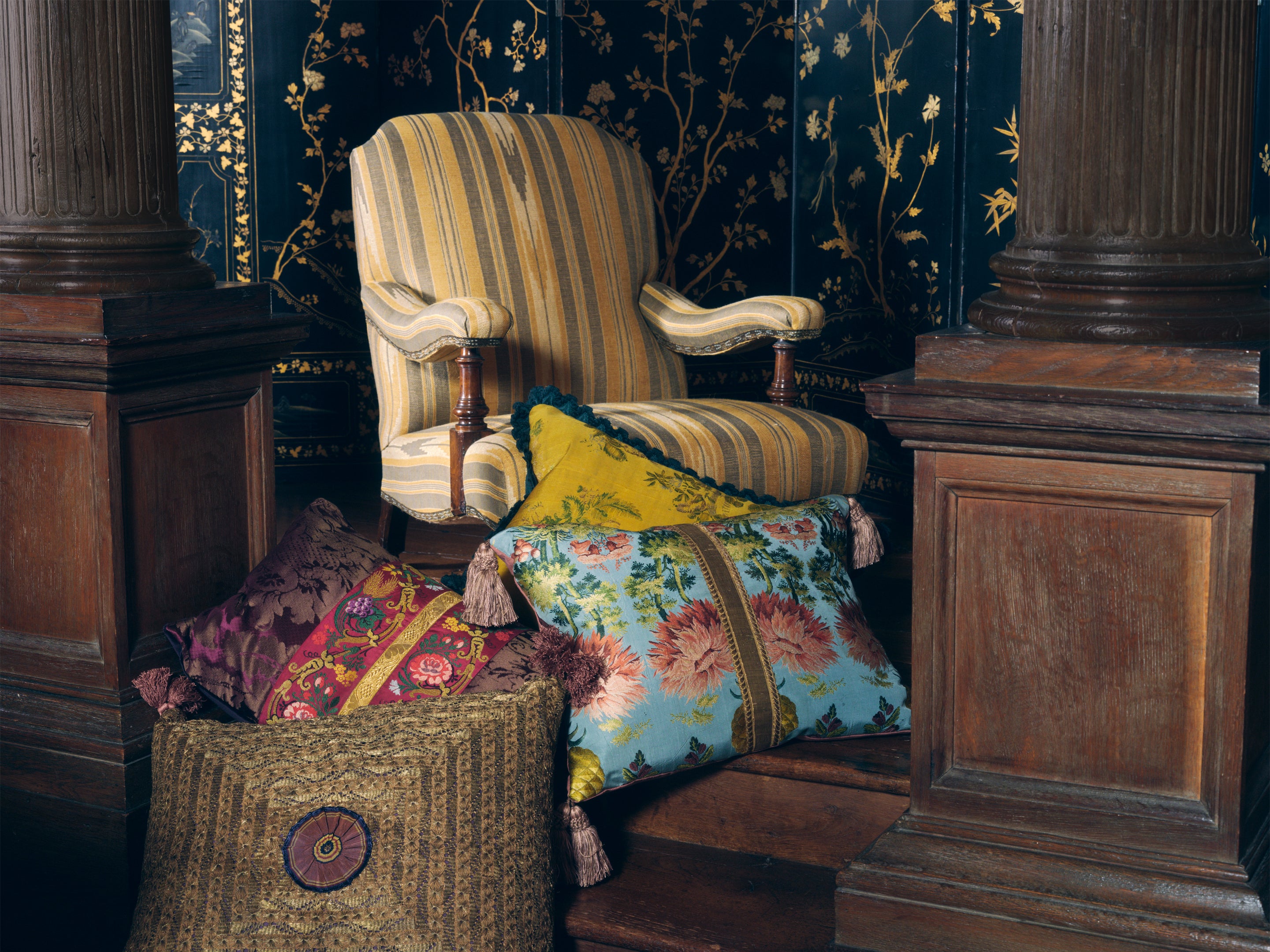 A large Old Gold cushion made with a rare 19th Century Ottoman panel with a handmade silk antique ribboned rosette and Italian silk tassels