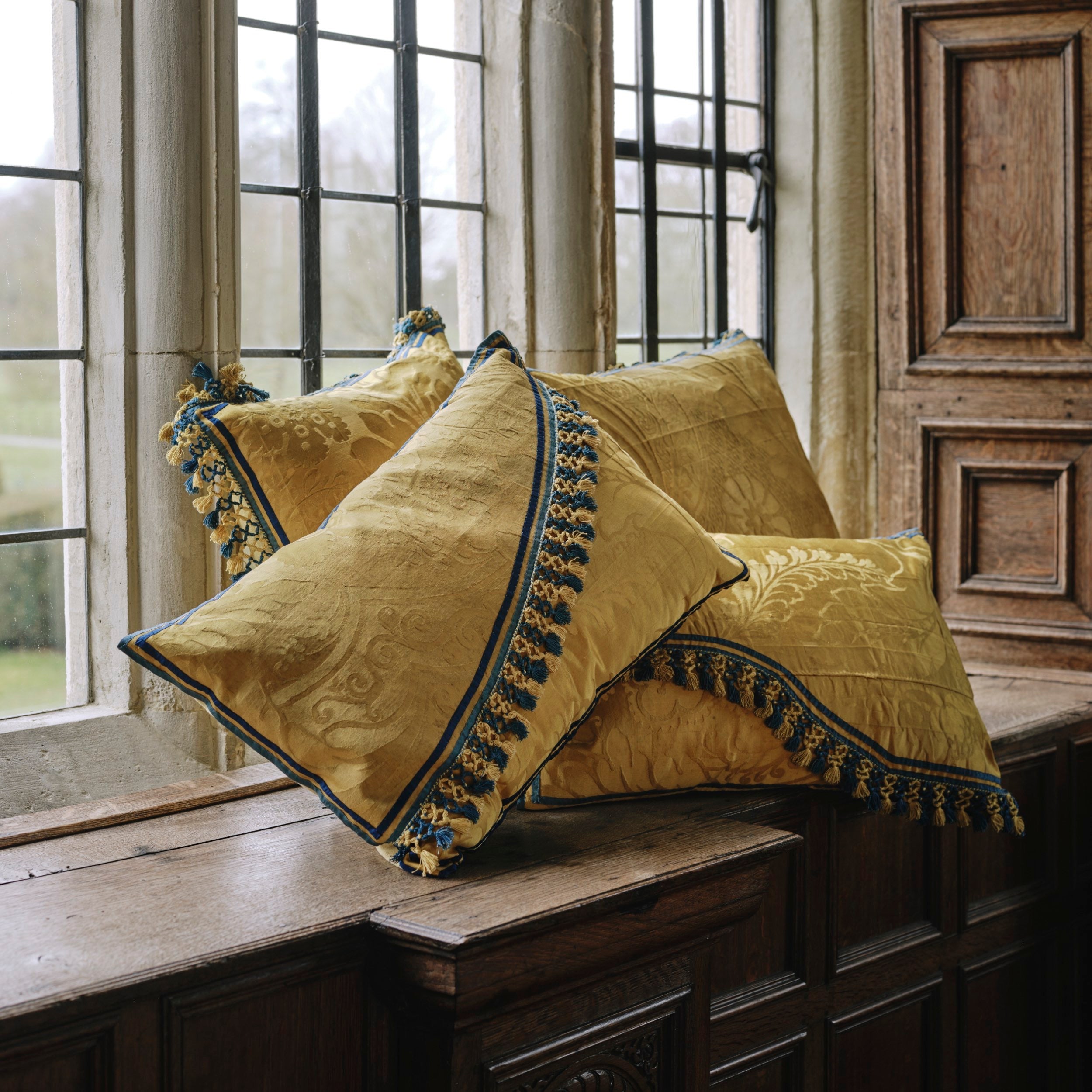A Pair of Square Vivid Yellow Damask Cushions with Original Tassel Fringe and Binding
